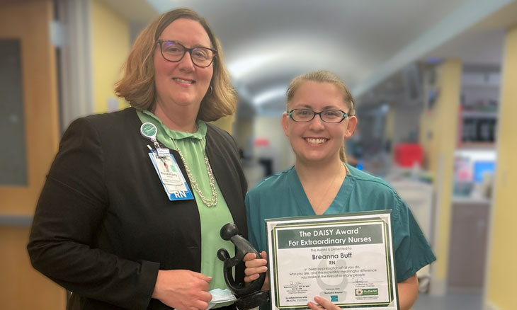 Feb 2024 DAISY Rosemary (Rosi) Wurster, DNP, RN, MPH, NEA-BC, CEN, and Breanna Buff, RN, with her DAISY Award