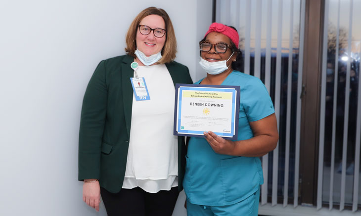 Rosemary (Rosi) Wurster, DNP, RN, MPH, NEA-BC, CEN, and Deneen Downing, CNA, with her Sunshine Award Rosemary (Rosi) Wurster, DNP, RN, MPH, NEA-BC, CEN, and Deneen Downing, CNA, with her Sunshine Award