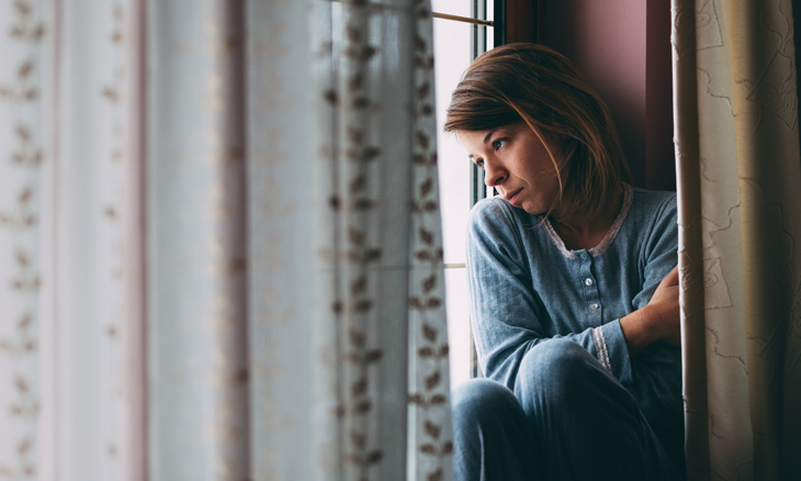 Woman looking out window