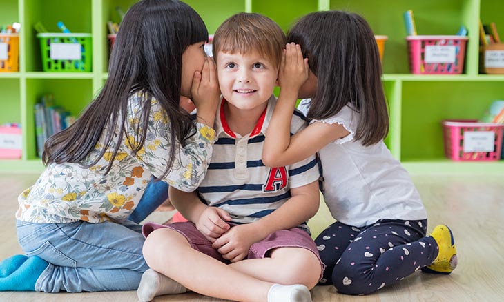Preschool children playing together at school