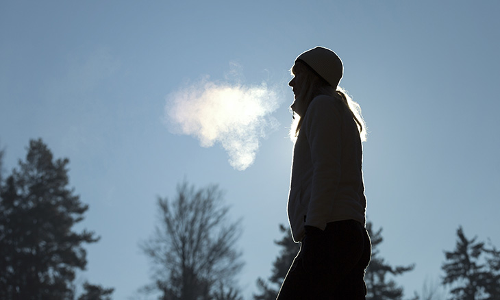 Bayhealth patient outside in winter exhaling warm breath