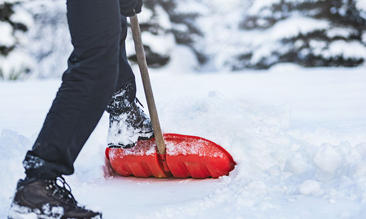 How to prevent injury when shoveling snow