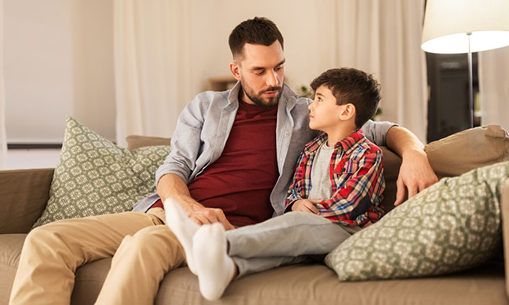 Father talking to child about COVID-19