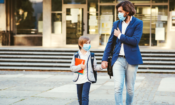 Father and son walk home from school