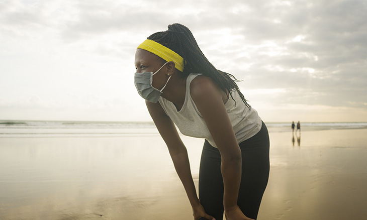 Female athlete with face mask