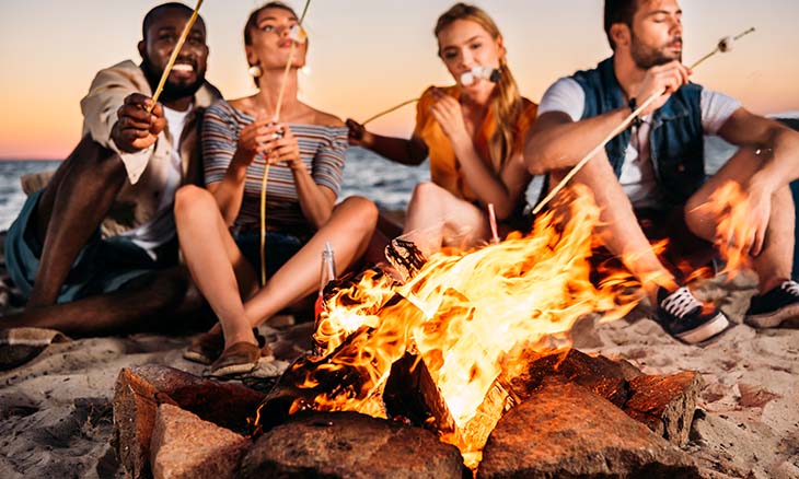Group gathered around bonfire on Memorial Day