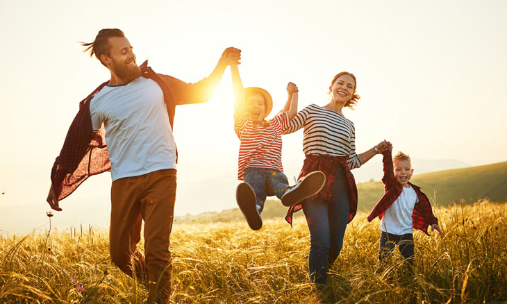 Young parents with two children enjoying the outdoors