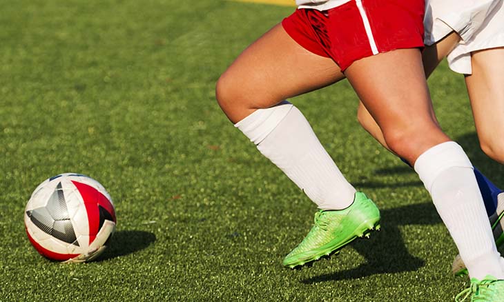 Student athlete playing soccer