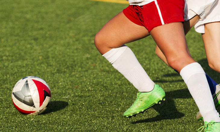 Student athlete playing soccer