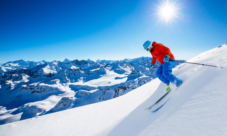 Skier going down a mountain