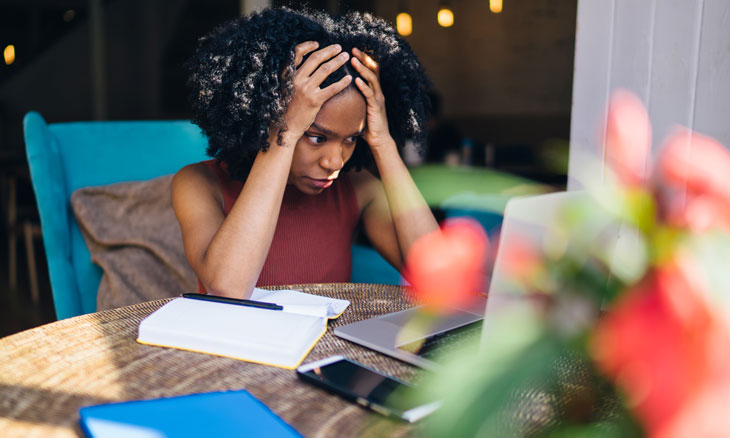 Woman stressed at her computer
