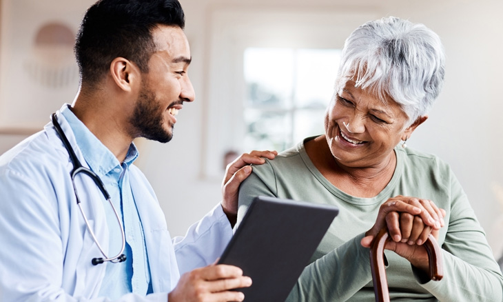 Bayhealth doctor smiling at older woman patient