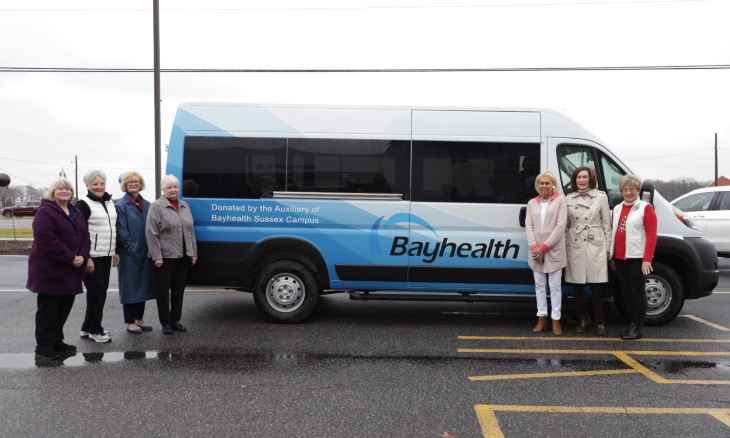 Auxiliary members and Bayhealth staff unveil new cancer transport van.