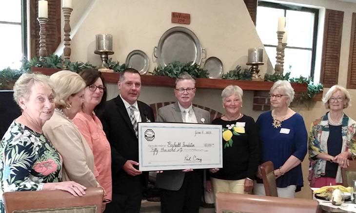 Auxiliary gifts a check to Bayhealth
