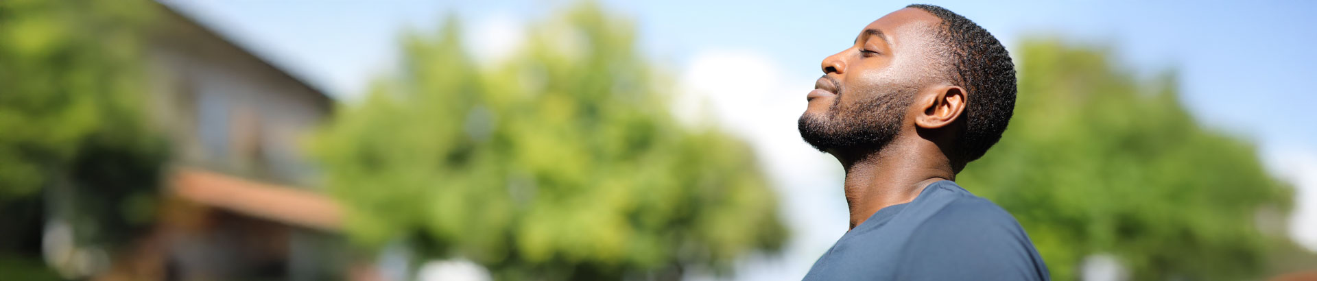 Man breathing clearly outdoors