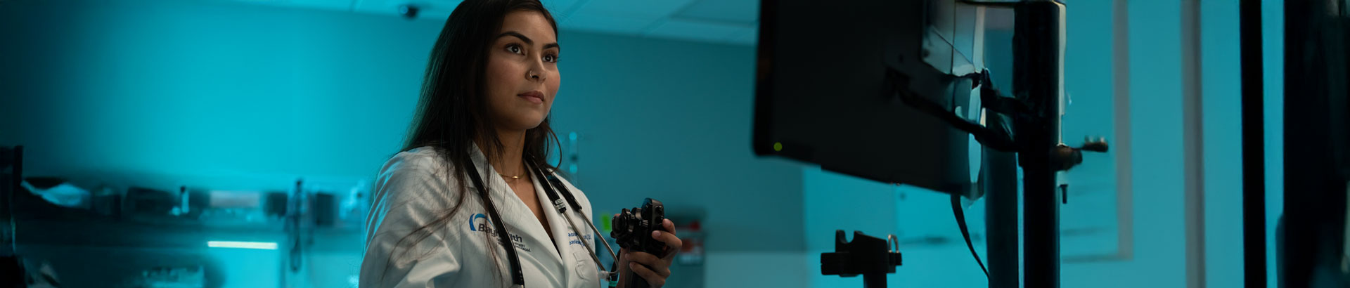 General Surgery resident looking at monitor