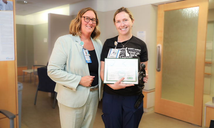 Rosemary (Rosi) Wurster, DNP, RN, MPH, NEA-BC, CEN, and Bayhealth’s Elizabeth Ford, RN, with her DAISY Award. Rosemary (Rosi) Wurster, DNP, RN, MPH, NEA-BC, CEN, and Bayhealth’s Elizabeth Ford, RN, with her DAISY Award.